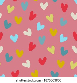 Seamless pattern. Hand drawn multicolored heart shapes on pink background, for wrapping paper and other design projects. Valentines Day concept, love, romance concept