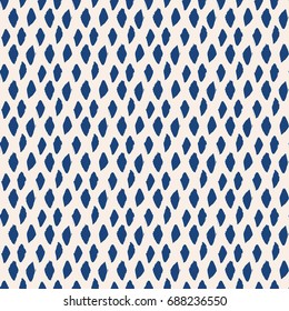 Seamless pattern with hand drawn navy rhombus and spots on beige background. Blue beige brush painted texture. Geometric graphic design. Scrapbook, textile, wallpaper print. Vector illustration.