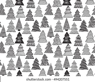 Seamless pattern with hand drawn ornate Christmas trees. Vector endless background of new year symbols in graphic doodle style.