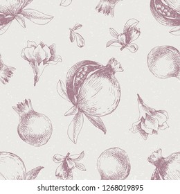 Seamless pattern with hand drawn pomegranates. Vector illustration