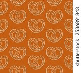 Seamless pattern of hand drawn pretzel in heart shape on brown background. Ideal for bakery, Oktoberfest theme, packaging and festive design.