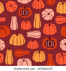 Seamless pattern with hand drawn pumpkin in cartoon style. Flat  background of pumpkins and squash on burgundy background. Autumn texture for thanksgiving, harvest and halloween. Vector Illustration