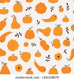 Seamless pattern with hand drawn pumpkins and leaves. Cute design  for Halloween or Thankful day. Vector vegetable illustration.