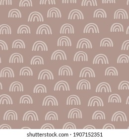 Seamless pattern with hand drawn rainbows in beige color on a brown background. Creative scandinavian kids texture for fabric, wrapping, textile, wallpaper, apparel. Vector illustration.