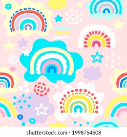 Seamless pattern with hand drawn rainbows, dots and clouds in pastel colors. Kids texture for fabric, wrapping, textile, wallpaper. Cartoon Vector Illustration.