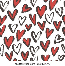 Seamless pattern with hand drawn red and black hearts. Hand drawing design. Decorative elements. Ink illustration. Romantic abstract wrapping paper.
