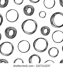 Seamless pattern of hand drawn scribble objects for logo, web, design use.  Black vector design circles collection on white background. Abstract grunge elements