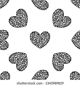 Seamless pattern of hand drawn sketch style hearts with leopard texture isolated on white background. Vector illustration.