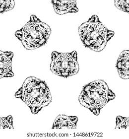 Seamless pattern of hand drawn sketch style portraits of snow leopard isolated on white background. Vector illustration.