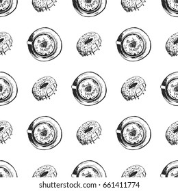 Seamless pattern of hand drawn sketch style coffee cups and donuts. Vector illustration.