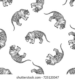 Seamless pattern of hand drawn sketch style tigers. Vector illustration isolated on white background.