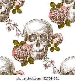 Seamless pattern with hand drawn skull with flowers on white background