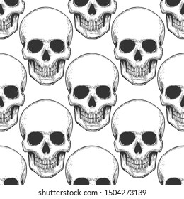 Seamless pattern with hand drawn skulls. Vector Illustration