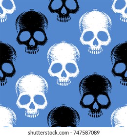 Seamless pattern with hand drawn skulls. Vector Illustration