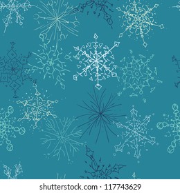 A seamless pattern of hand drawn snowflakes on a blue background.