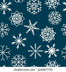 Seamless pattern with hand drawn snowflakes. Abstract brush strokes. Ink illustration. Winter pattern for wrapping paper.