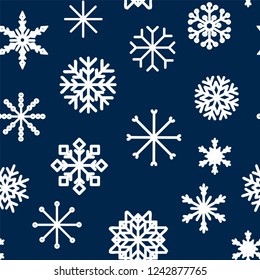 Seamless pattern with hand drawn snowflakes. Abstract brush strokes. Ink illustration. Winter pattern for wrapping paper.