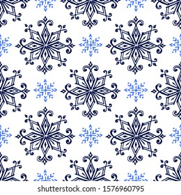 Seamless pattern with hand drawn snowflakes on white background. Suitable for packaging, wrappers, fabric design