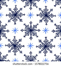 Seamless pattern with hand drawn snowflakes on white background. Suitable for packaging, wrappers, fabric design