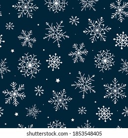 Seamless pattern with hand drawn snowflakes on blue background. Good for christmas wrapping paper,  textile prints, wallpaper,  packaging, etc. EPS 10