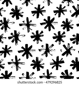 Seamless pattern with hand drawn snowflakes. Abstract brush strokes. Ink illustration. Winter pattern for wrapping paper.