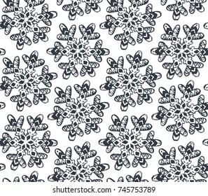Seamless pattern with hand drawn snowflakes. Black and white vector holiday endless background