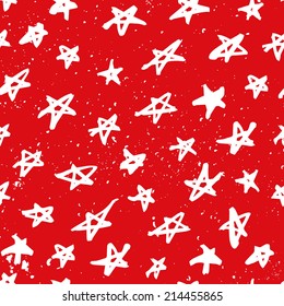 Seamless pattern with hand drawn stars. Abstract ink stars background. Red and white abstract ornament with stars.