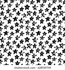 Seamless pattern with hand drawn stars. Ornament for wrapping paper. Modern brush calligraphy. Hand drawn lettering background. Ink illustration. Isolated on white background. 