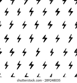 Seamless pattern with hand drawn thunderbolt cartoon shapes. Ink doodles.