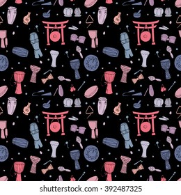 Seamless pattern with hand drawn  traditional percussion instruments in pale pink and blue colors on black background. EPS 10.