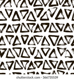 Seamless pattern with hand drawn triangles. Hand drawn pattern. Ornament for wrapping paper. Ink illustration. Modern brush calligraphy. Hand drawing vector art.