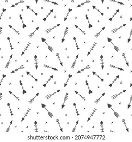 Seamless pattern with hand drawn tribal arrows, isolated on white. Scandinavian style. Cute ethnic childish background, wrapping paper, nursery wallpaper, fashion textile. Vector illustration.
