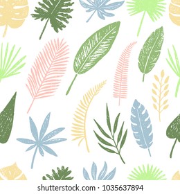 Seamless pattern of hand drawn tropical leaves and flowers.Vector illustration.