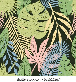 Seamless pattern of hand drawn tropical leaves and flowers.Vector illustration.