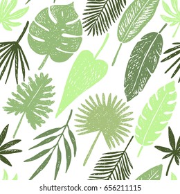Seamless pattern of hand drawn tropical leaves and flowers.Vector illustration.