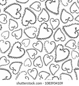 Seamless pattern with hand drawn twigs in the shape of hearts. Vector illustration on white background. Black on white.