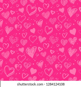 Seamless pattern with hand drawn Valentine grunge hearts in pink colors.