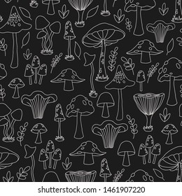 Seamless pattern with hand drawn vector mushrooms. Line art, doodle mushrooms on a black background. 