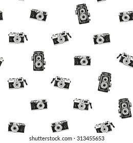 Seamless pattern with hand drawn vintage photo cameras