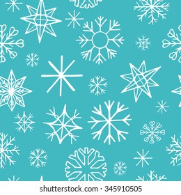 Seamless pattern with hand drawn white snow flakes on blue background, simple winter background for your design