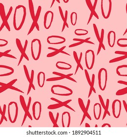 Seamless pattern with hand drawn word XoXo meaning kisses. Valentine's day background.