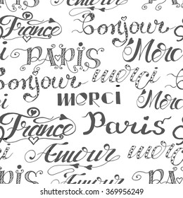 Seamless pattern of hand drawn words. Hand drawn words: merci, Paris, amour, France, bonjour. French words. Ink illustration Handwritten lettering.