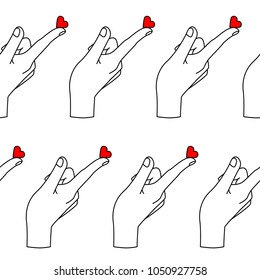 Seamless pattern with hand and heart.