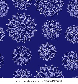 Seamless pattern with hand-drawn beautiful lace mandalas, white outline on a trendy background phantom blue, for the design of covers, packaging, print on textiles