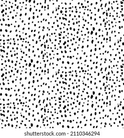 Seamless pattern of hand-drawn black dots. Suitable as a pattern for fabric