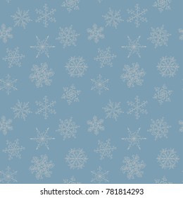 Seamless pattern of hand-drawn blue vintage snowflake with curls
