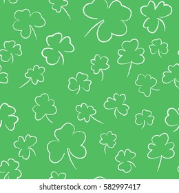 Seamless pattern with hand-drawn clover leaves. Saint Patrick's day design