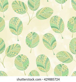 Seamless pattern of hand-drawn and colored leaves. vector graphics .