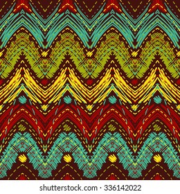seamless pattern of hand-drawn colorful zigzags on terracotta background