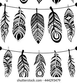 Seamless pattern with hand-drawn feathers flowers and ornaments. The pattern for your design.